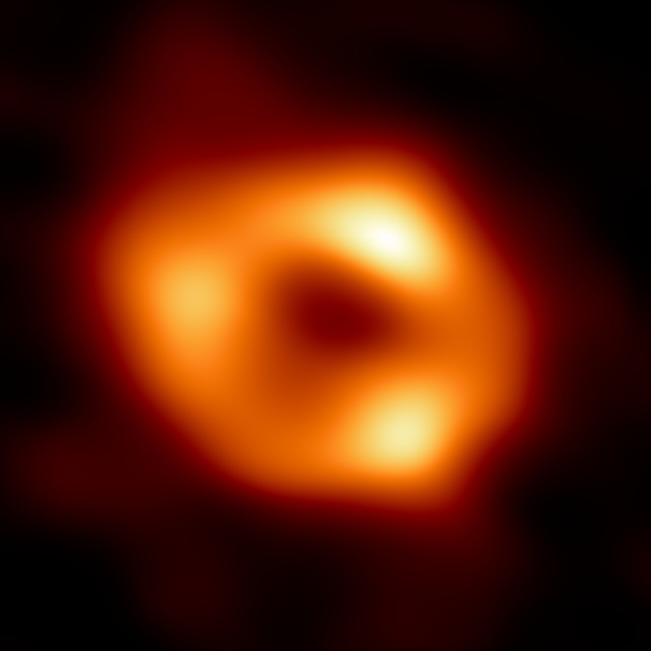 First image of Sgr A*, the black hole at the center of the Milky Way: a dark central shadow surrounded by a bright ring.